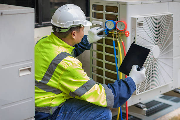 Professional Heat Pump Repair technician working in Alford, FL